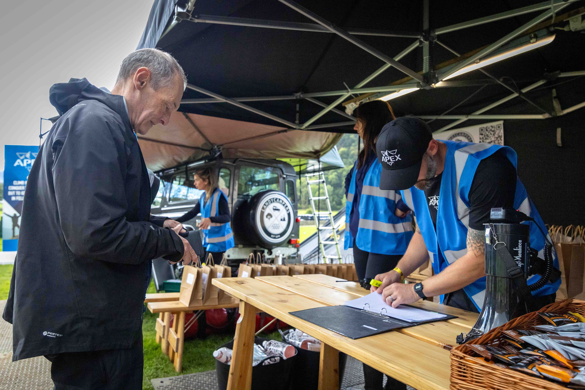 a man signing into entry at APEX everest